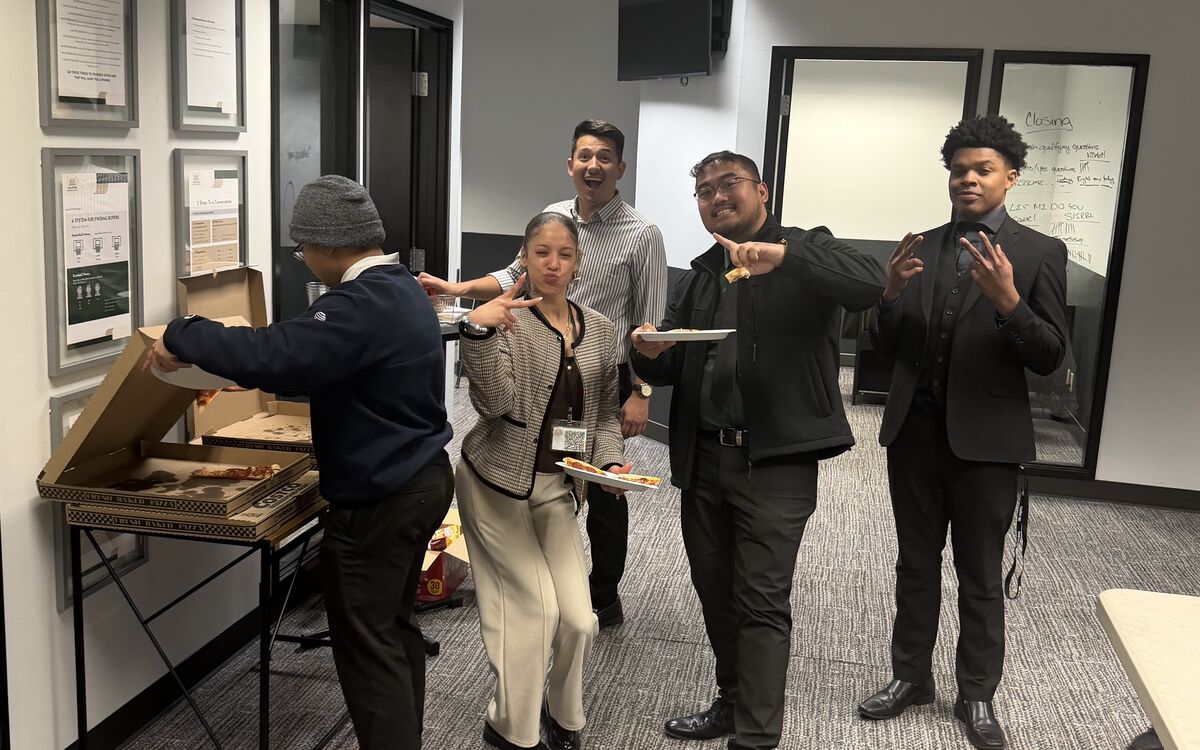 Noble Summit Management team members engaging with one another in the office